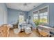Serene bedroom with light blue walls and a metal bed frame at 222 Haddrell St, Mount Pleasant, SC 29464
