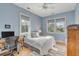 Bright bedroom featuring a workspace, full bed, and light blue walls at 222 Haddrell St, Mount Pleasant, SC 29464