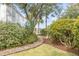 Charming brick walkway leads through lush landscaping to a beautiful home at 222 Haddrell St, Mount Pleasant, SC 29464