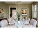 Formal dining room with chandelier, hardwood floors, and antique mirror at 222 Haddrell St, Mount Pleasant, SC 29464