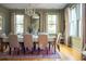 Elegant dining room with a rustic table, chandelier, and neutral color palette at 222 Haddrell St, Mount Pleasant, SC 29464