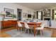 Elegant dining room with hardwood floors, a wood table, and white chairs at 222 Haddrell St, Mount Pleasant, SC 29464