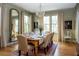 Formal dining room with a large table, chandelier, and hardwood floors at 222 Haddrell St, Mount Pleasant, SC 29464