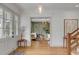 Light-filled entryway with hardwood floors, view of living room, and neutral decor at 222 Haddrell St, Mount Pleasant, SC 29464