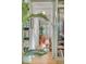 Home office with built-in shelves and an orange chair at 222 Haddrell St, Mount Pleasant, SC 29464