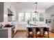 Bright kitchen featuring marble countertops, island seating, and stainless steel appliances at 222 Haddrell St, Mount Pleasant, SC 29464