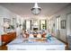 Open concept kitchen with marble island, hardwood floors, and views into the dining area at 222 Haddrell St, Mount Pleasant, SC 29464