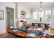 Modern kitchen with white cabinets and a marble countertop at 222 Haddrell St, Mount Pleasant, SC 29464