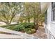 Landscaped garden with brick walkway and white staircase leading to home entrance at 222 Haddrell St, Mount Pleasant, SC 29464