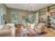 Bright library with built-in bookshelves, comfortable seating, and hardwood floors at 222 Haddrell St, Mount Pleasant, SC 29464