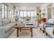 Living room with a view into the kitchen and cozy seating at 222 Haddrell St, Mount Pleasant, SC 29464