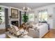 Relaxing living room with a fireplace and ample natural light at 222 Haddrell St, Mount Pleasant, SC 29464