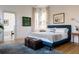 Main bedroom with blue upholstered bed and light grey bedding at 222 Haddrell St, Mount Pleasant, SC 29464