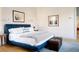 Main bedroom with blue upholstered bed and light grey bedding at 222 Haddrell St, Mount Pleasant, SC 29464