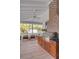 Screened porch with a built-in stainless steel grill and wood cabinets at 222 Haddrell St, Mount Pleasant, SC 29464