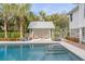 Inviting pool with a pergola and lush landscaping at 222 Haddrell St, Mount Pleasant, SC 29464