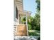 Charming front porch with wooden stairs, flag, and potted plant at 222 Haddrell St, Mount Pleasant, SC 29464