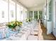 Elegant outdoor dining space with long table, floral decor and blue glasses at 222 Haddrell St, Mount Pleasant, SC 29464