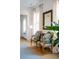 Sitting area with antique armchairs and a large mirror at 222 Haddrell St, Mount Pleasant, SC 29464