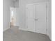 Bedroom with carpet, double doors to closet and view to another room at 2253 Blue Bayou Blvd, Johns Island, SC 29455