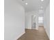 Light hallway with wood floors and access to bathroom at 2253 Blue Bayou Blvd, Johns Island, SC 29455
