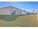 Landscaped backyard with grassy area and wooden fence at 286 W Bradford Pointe Dr, Summerville, SC 29486