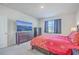 Cozy bedroom with a large TV, dresser, and red bedding at 286 W Bradford Pointe Dr, Summerville, SC 29486