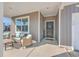 Front porch with seating area and a black front door at 286 W Bradford Pointe Dr, Summerville, SC 29486