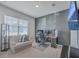 Bright home office with desk, comfortable seating, and large TV at 286 W Bradford Pointe Dr, Summerville, SC 29486