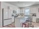 Modern kitchen with white cabinets, granite countertops, and stainless steel appliances at 286 W Bradford Pointe Dr, Summerville, SC 29486