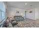 Living room with two black leather reclining sofas and a large TV at 286 W Bradford Pointe Dr, Summerville, SC 29486