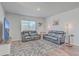 Spacious living room with two black reclining sofas and large TV at 286 W Bradford Pointe Dr, Summerville, SC 29486