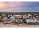 Aerial view of beach home community at sunset at 309 Palmetto Blvd, Edisto Island, SC 29438