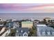 Beach house and neighborhood, aerial view at 309 Palmetto Blvd, Edisto Island, SC 29438