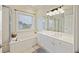Bathroom with a soaking tub and double vanity at 309 Palmetto Blvd, Edisto Island, SC 29438