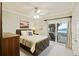 Bedroom with a striped comforter and ocean view at 309 Palmetto Blvd, Edisto Island, SC 29438
