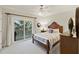 Bedroom with sliding glass doors and ocean view at 309 Palmetto Blvd, Edisto Island, SC 29438