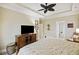 Bedroom with ensuite bathroom access and a TV at 309 Palmetto Blvd, Edisto Island, SC 29438