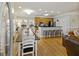 Large dining table with seating for ten, adjacent to kitchen at 309 Palmetto Blvd, Edisto Island, SC 29438
