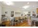 Bright dining room with a large table and hardwood floors at 309 Palmetto Blvd, Edisto Island, SC 29438