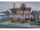 Two-story beach home with wrap-around porch and ocean views at 309 Palmetto Blvd, Edisto Island, SC 29438