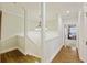 Upstairs hallway with hardwood floors and access to bedrooms at 309 Palmetto Blvd, Edisto Island, SC 29438