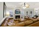 Spacious living area featuring a sectional sofa and fireplace at 309 Palmetto Blvd, Edisto Island, SC 29438