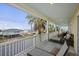 Relaxing porch with lounge chairs and ocean views at 309 Palmetto Blvd, Edisto Island, SC 29438