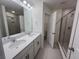 Double vanity bathroom with large shower and tile flooring at 413 Trotters Ln, Moncks Corner, SC 29461