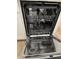 Interior view of a stainless steel dishwasher, showcasing its racks and spray arms at 413 Trotters Ln, Moncks Corner, SC 29461