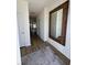 Bright entryway with hardwood floors, a large mirror, and access to other rooms at 413 Trotters Ln, Moncks Corner, SC 29461