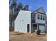 Gray siding two-story house with a side view of the home at 413 Trotters Ln, Moncks Corner, SC 29461