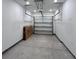 Garage with new white garage door and white walls ready for parking two cars at 413 Trotters Ln, Moncks Corner, SC 29461