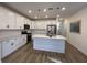 Modern kitchen with white cabinets, quartz countertops, and an island at 413 Trotters Ln, Moncks Corner, SC 29461